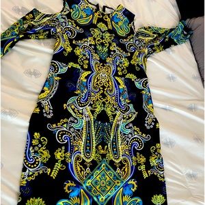 Pretty body con knee length dress. Peak a boo shoulders.